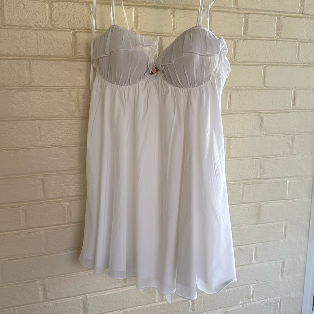 White, short, cupped dress with small pink flower, double lined, tie in back